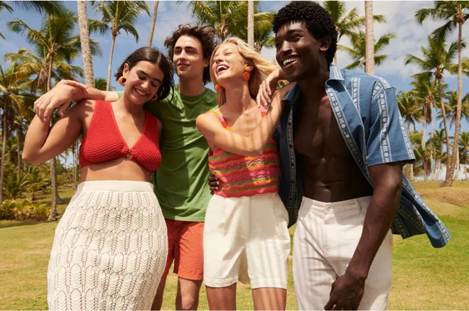 A group of friends standing together and smiling